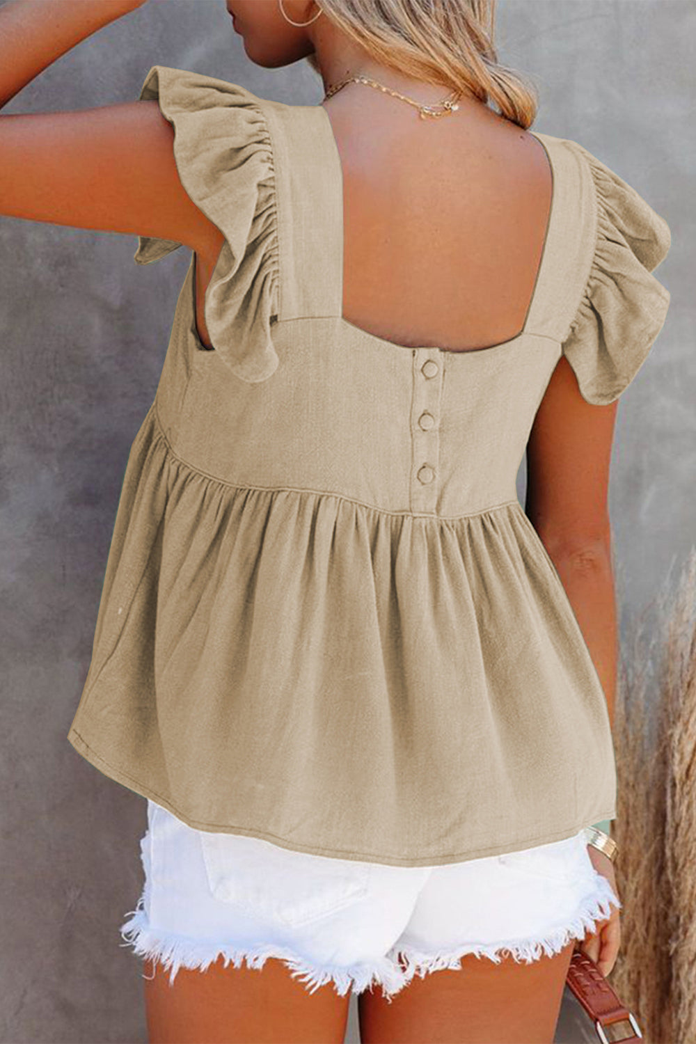 Khaki linen babydoll top with flutter sleeves and square neckline, button back detail.