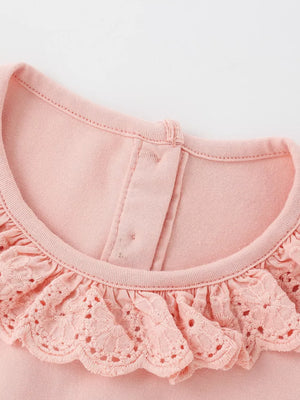 Pink baby dress with ruffled eyelet collar and cap sleeves.