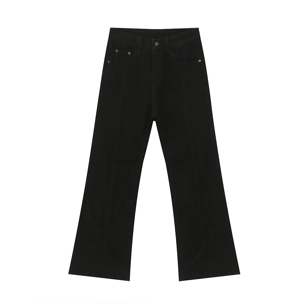 Black denim jeans with panel seams and a flare leg cut.
