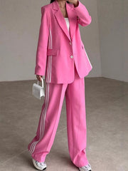 Hot Pink pant suit with white track stripes on blazer and pants.