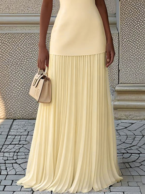 Yellow sleeveless top and pleated maxi skirt set with a boat neck.