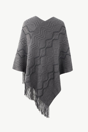 Charcoal knit poncho with geometric pattern and fringe detail
