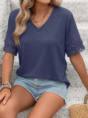 Navy blue V-neck t-shirt with lace trim on the sleeves.