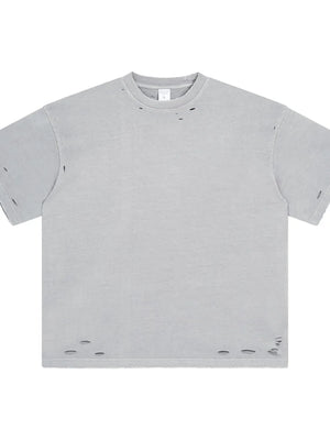 Distressed oversized gray cotton t-shirt with raw hem and ripped details.