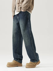 Relaxed fit vintage blue denim jeans with a faded wash and straight leg.