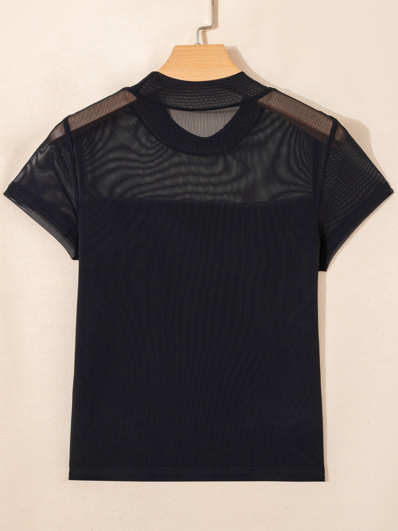 Black sheer mesh cap sleeve t-shirt with mock neck and ribbed body.