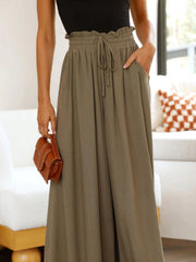 Olive brown textured drawstring palazzo trousers with ruffled waist and pockets.