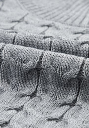 Gray cable knit turtleneck capelet sweater with acrylic material.