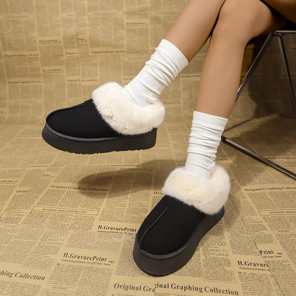 Black plush suede platform slippers with cream faux fur trim and white slouchy socks.