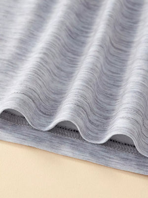 Toddler tee fabric detail, heather grey cotton blend with textured marled pattern.