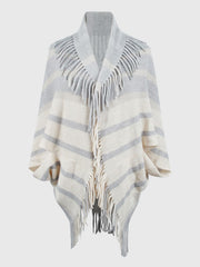 Textured fringe capelet in ivory with grey stripes and fringe detail.