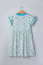 Floral dress with notched neckline, cap sleeves, and blue floral print on cotton blend.