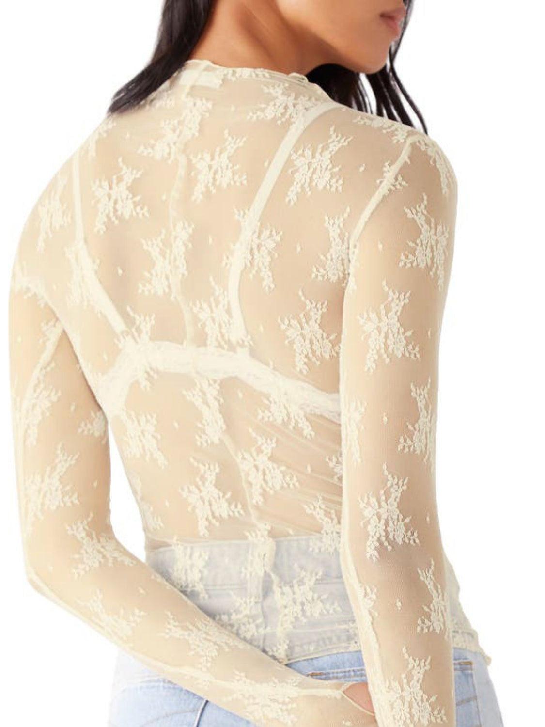 Cream lace illusion mock neck top with long sleeves and floral pattern.