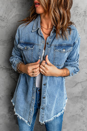 Oversized denim shirt jacket in dark blue with frayed hem and button front.