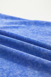 Blue mineral wash cotton t-shirt with a distressed look and subtle texture.