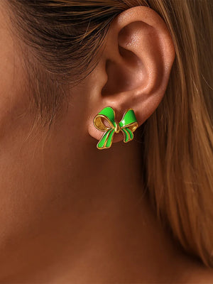 Green enamel bow stud earrings with gold detailing