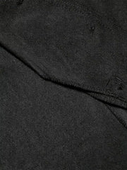 Black tailored vest with scalloped hem detail and visible stitching.