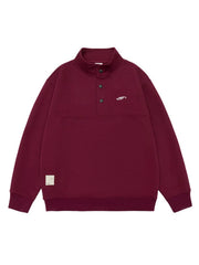 Maroon cotton blend sweatshirt with buttoned neckline and embroidered logo.