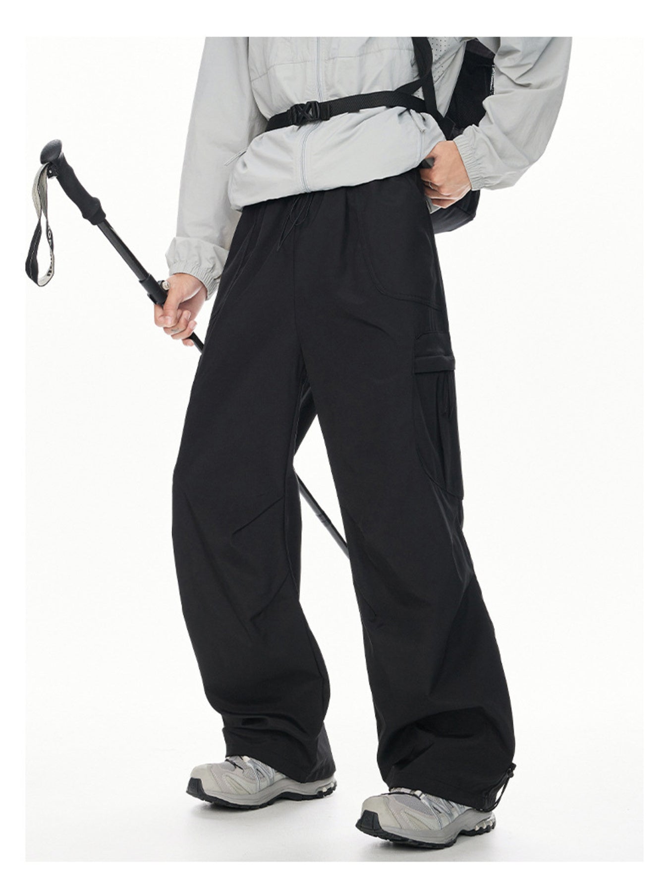 Men's black relaxed fit cargo sweatpants with adjustable drawstring waist and ankle cuffs.