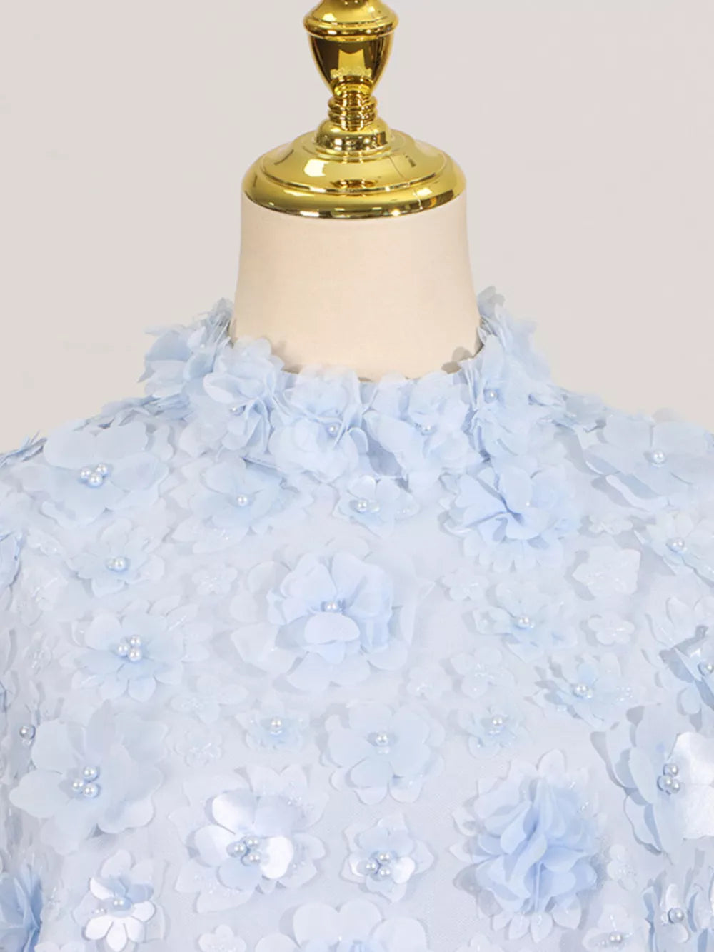 Blue ruffled floral applique mini dress with pearl accents