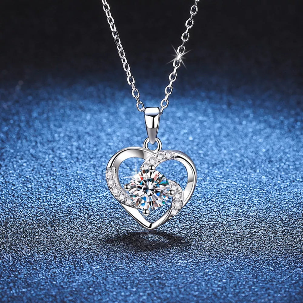 Silver heart pendant necklace with clear zircon and crystal accents.