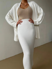 Cream ribbed knit co-ord set with a long sleeve cardigan and midi skirt.