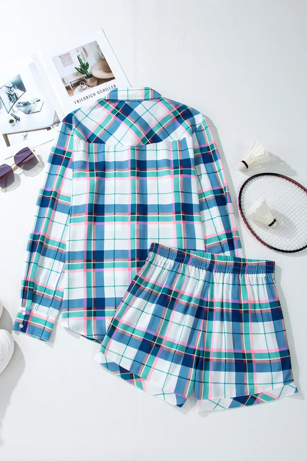 Plaid pajama set with ruffled hem shorts and long sleeve button-up shirt.