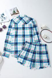 Plaid pajama set with ruffled hem shorts and long sleeve button-up shirt.