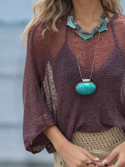 Textured knit batwing cover-up in mauve acrylic with sheer sleeves and boho styling.