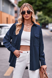 Dark blue oversized utility shirt with button-front, chest pockets, and long sleeves.
