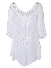 White crochet-trimmed flowy cover-up with V-neck and cutout details.