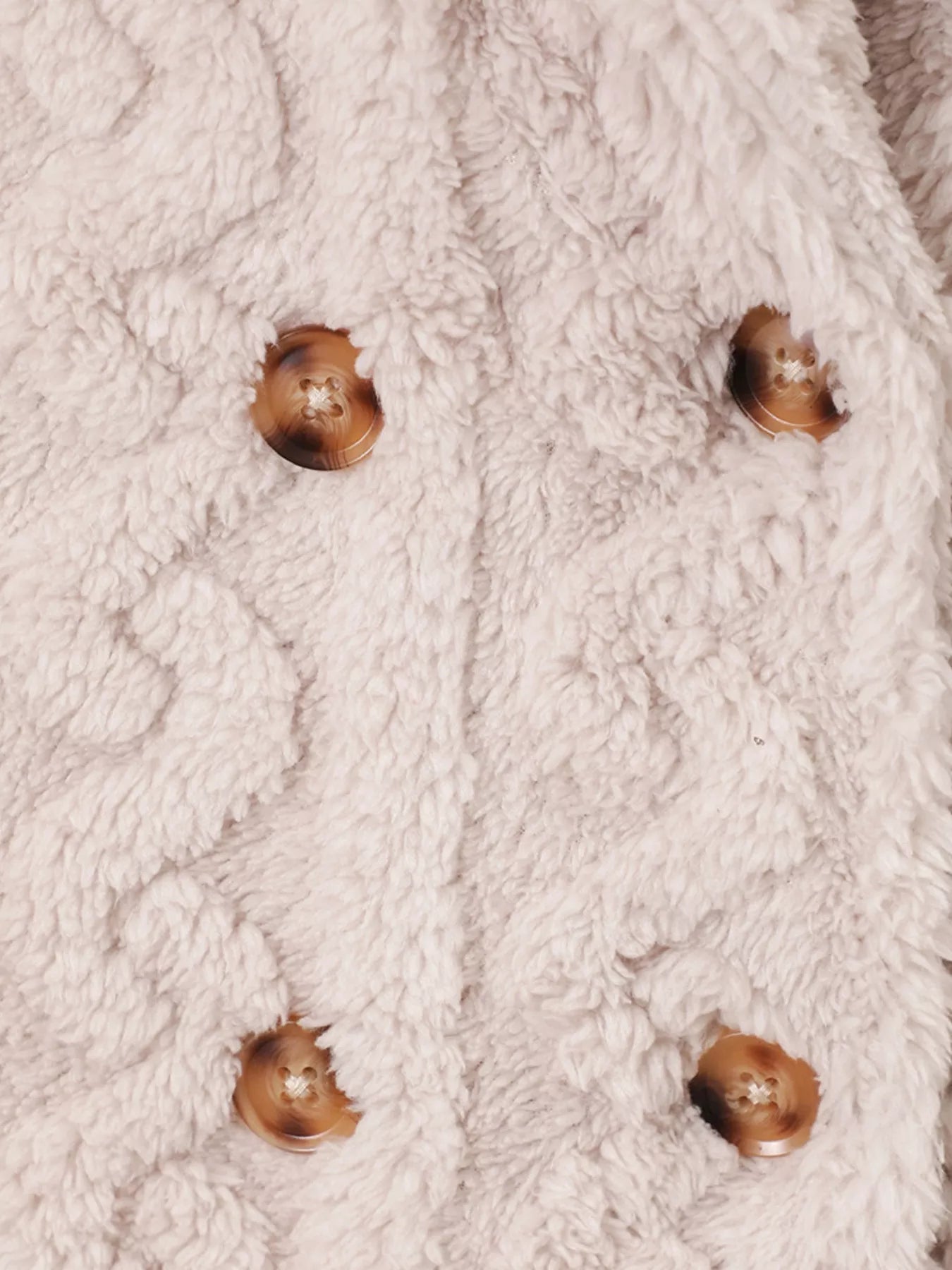 Cozy textured double-breasted pea coat in eggshell with brown buttons
