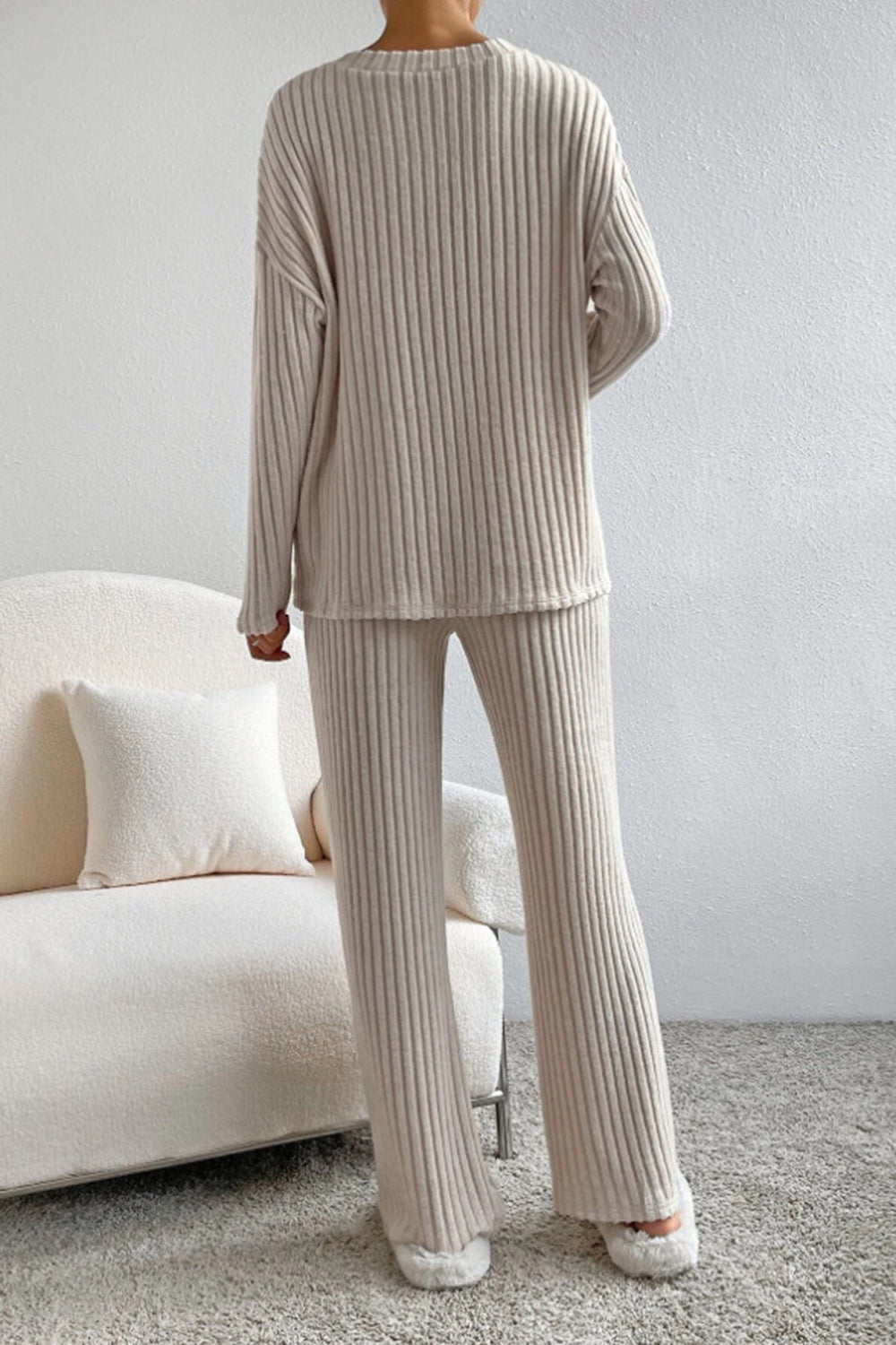 Cozy ribbed knit lounge set in camel, featuring a crewneck sweater and wide-leg pants.