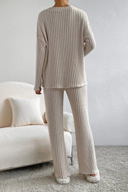 Cozy ribbed knit lounge set in camel, featuring a crewneck sweater and wide-leg pants.