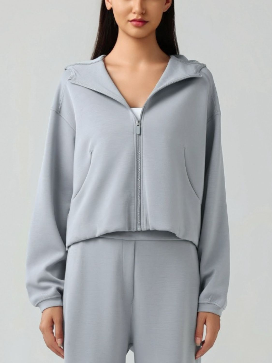 Gray cropped active zip-up hoodie with raglan sleeves and pockets