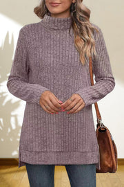 Ribbed knit turtleneck tunic top in Lavender with long sleeves and side slits.