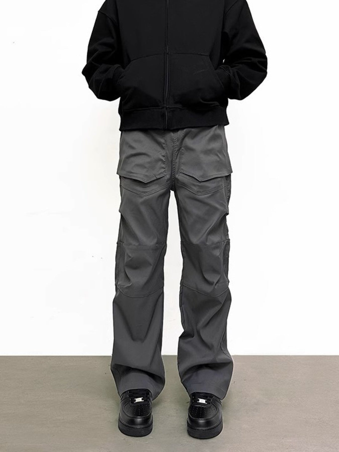 Men's gray sweatpants with multiple pockets and a relaxed fit.