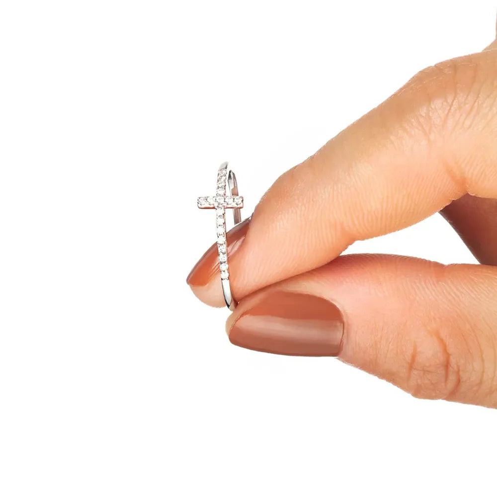 Sterling silver ring with pavé cross detail and clear stones