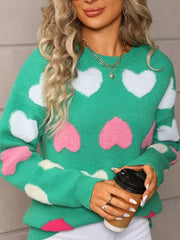 Green acrylic sweater with fuzzy heart pattern, crew neck, long sleeves.