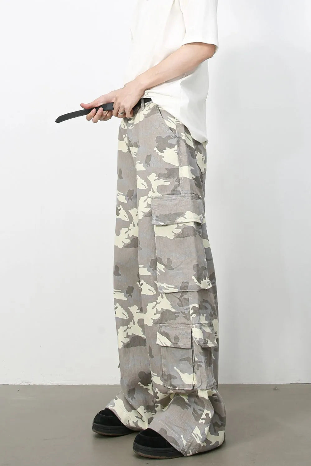 Urban Warrior cargo jeans in gray camouflage with multiple pockets and a relaxed fit.
