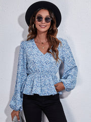 Floral print cinched waist blouse in Misty Blue with balloon sleeves and V-neck