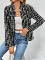 Black and white tweed open-front blazer with a plaid pattern, worn with a white top and jeans.