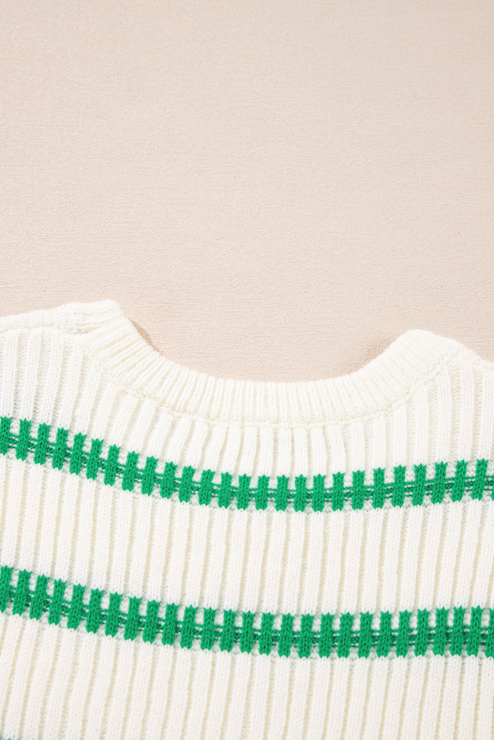 Ribbed knit vest in cream with green stitch stripes and a crew neck.