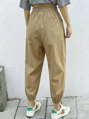 Khaki relaxed fit harem joggers with elastic waist and cuffs, featuring side pockets.
