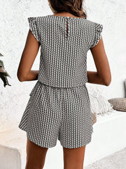 Black and white patterned co-ord set with ruffle sleeves and shorts.