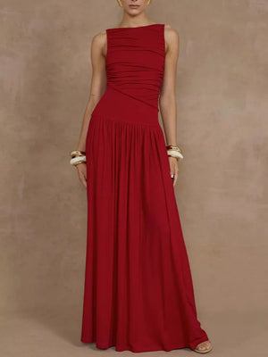 Red ruched maxi dress with a gathered bodice and flowing skirt.