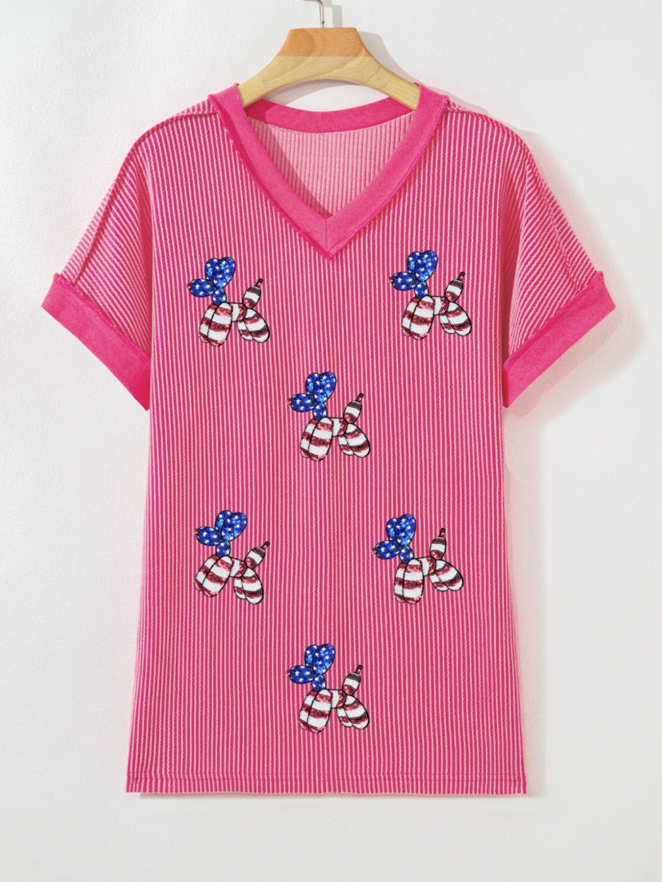 Pink striped V-neck tee with patriotic sequin balloon dog graphic and elastane blend.