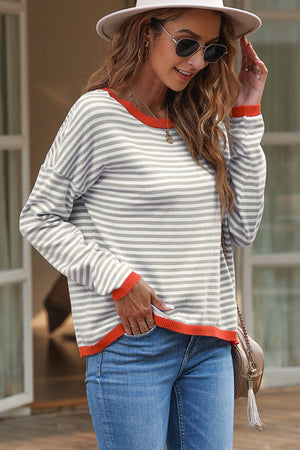 Striped crewneck sweater with contrast orange trim and long sleeves