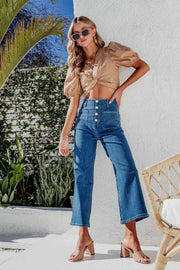 Button-front cropped wide-leg jeans in light blue denim with a high waist and four-button closure.