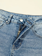 Vintage-inspired high-waisted seam jeans in blue denim with a zip fly and button closure.